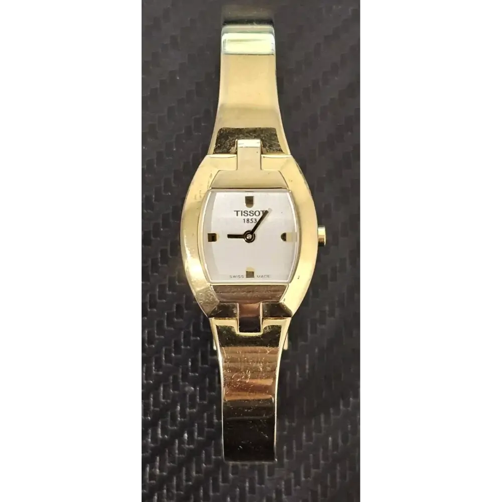 Gold wristwatch with a white face