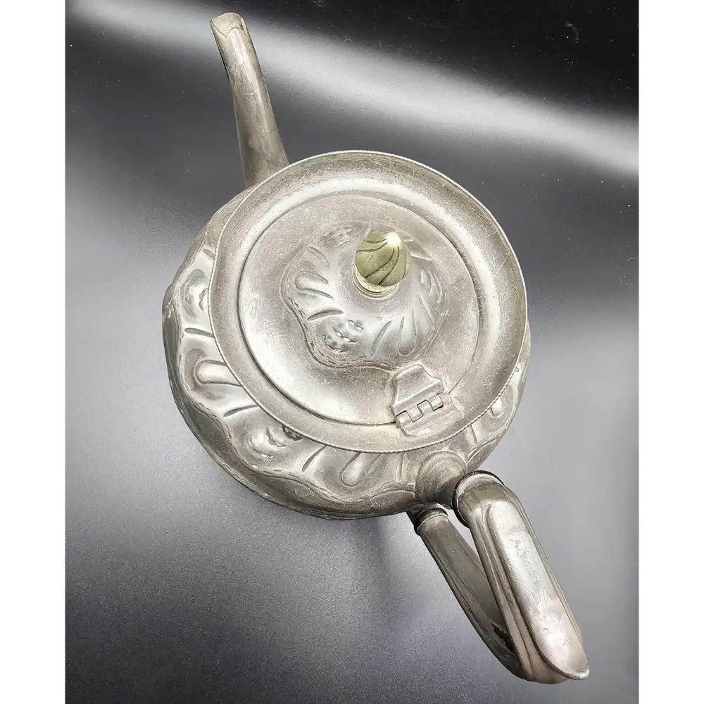 Silver decorative object with intricate designs