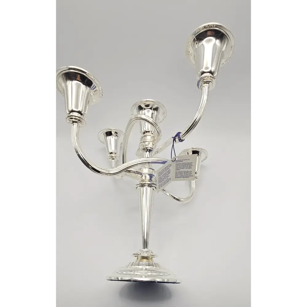 Silver candelabra on a gray background