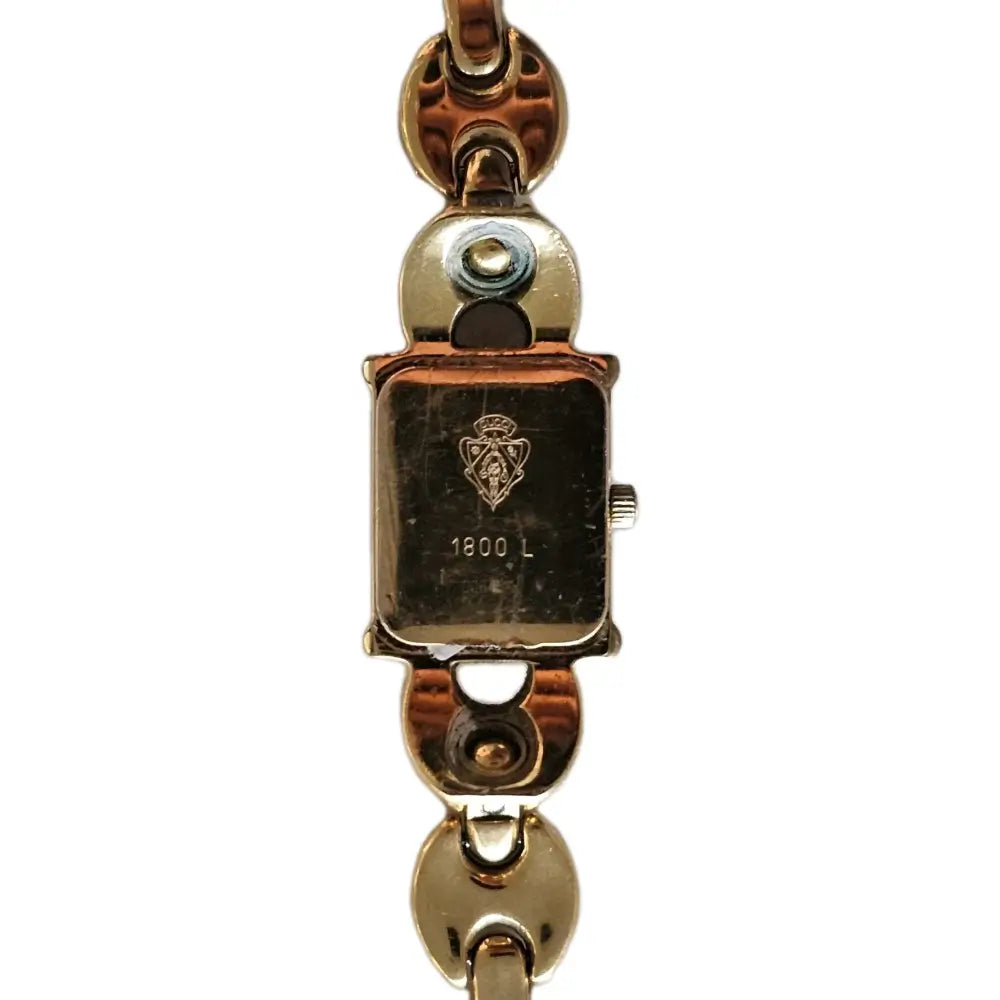 Gold watch with a visible brand logo