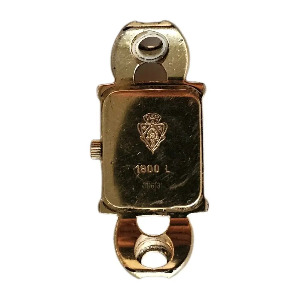Gold watch case with brand logo on a white background