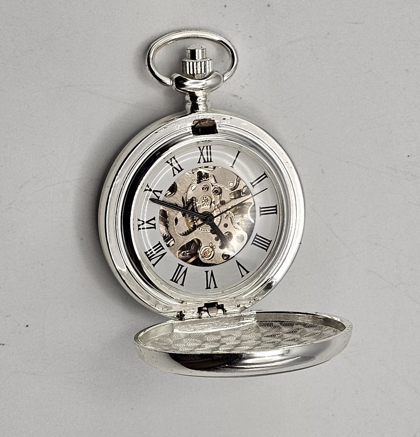 Silver pocket watch with open face