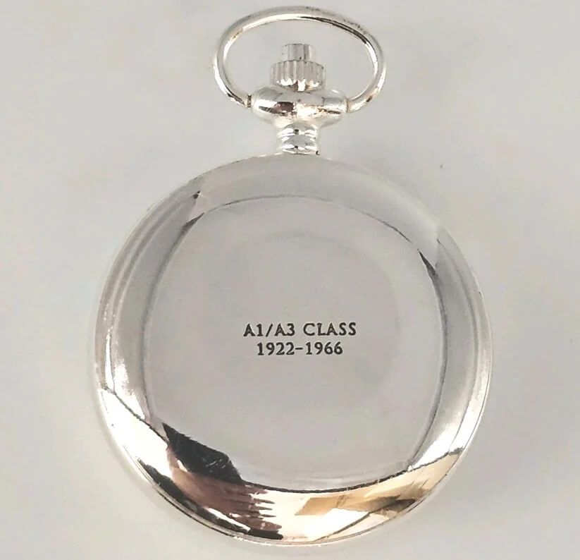 Silver pocket watch with engraved text on a white background