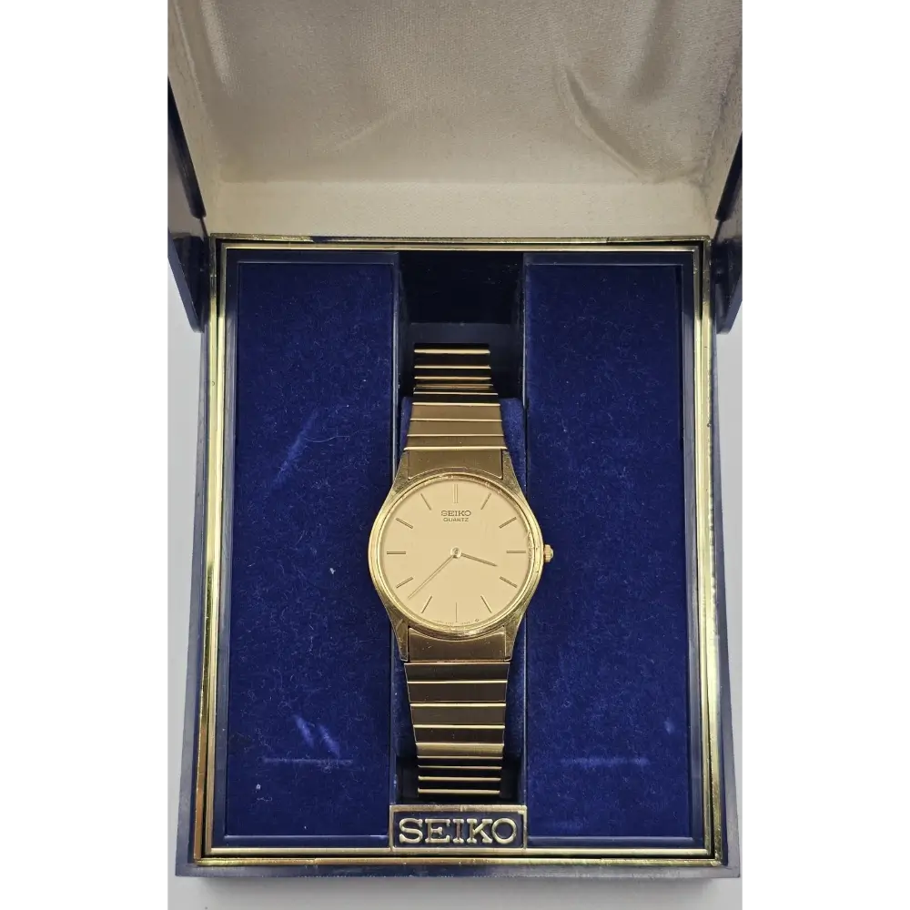 Gold Seiko watch in a box with blue interior