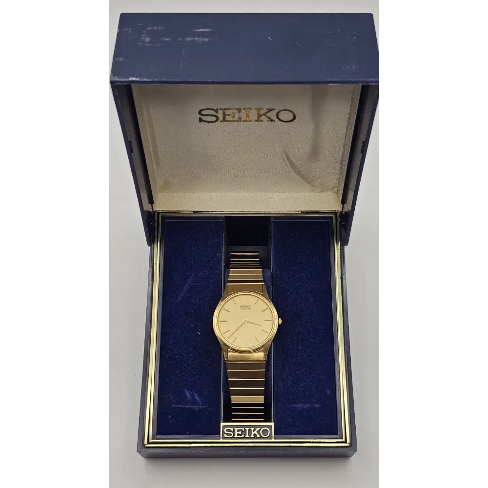 Gold Seiko watch in an open blue Seiko box