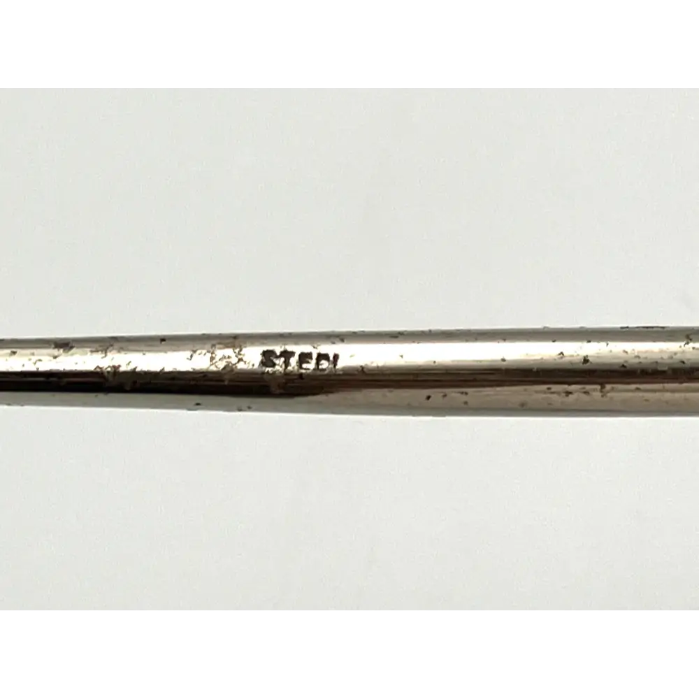 Detailed craftsmanship of 1900 sterling silver shoehorn and button hook