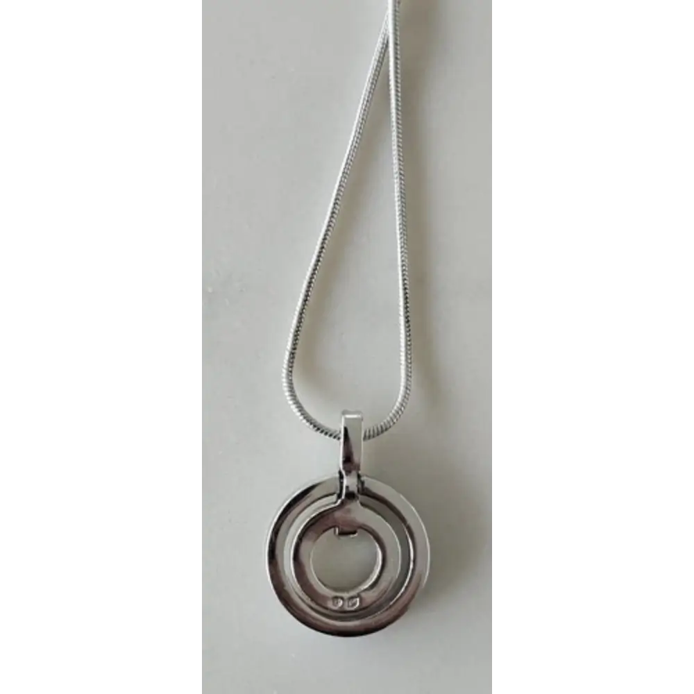 Silver necklace with a circular pendant