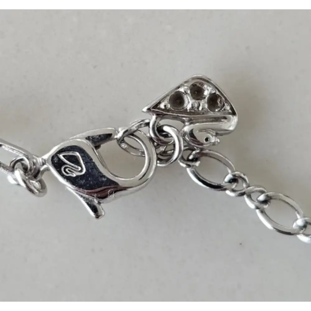 Silver bracelet with various charms