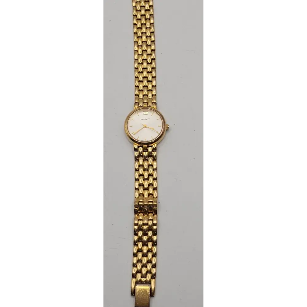 Gold wristwatch with a mesh band