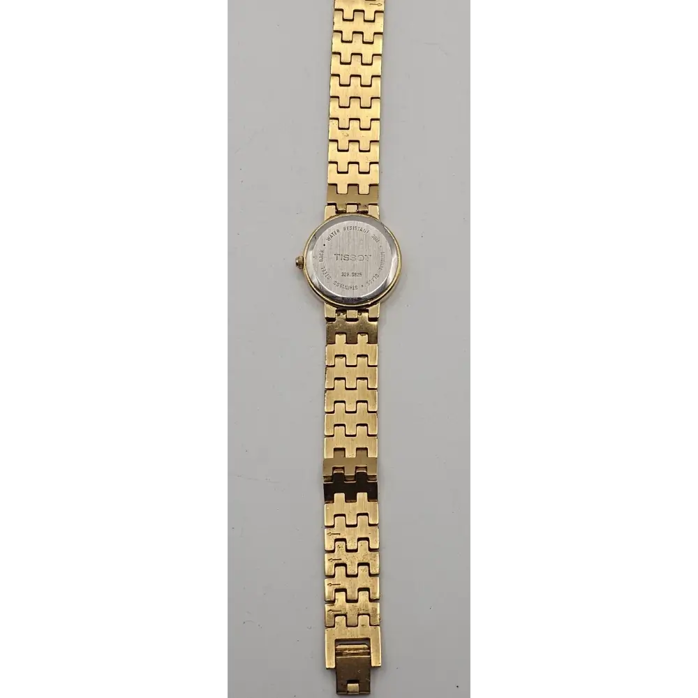 Gold watch with a textured band
