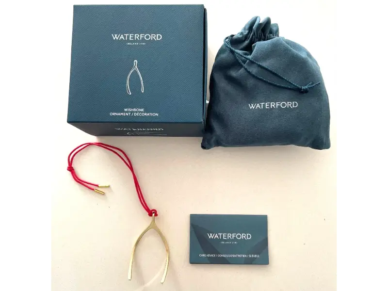 Waterford wishbone ornament with packaging on a white background