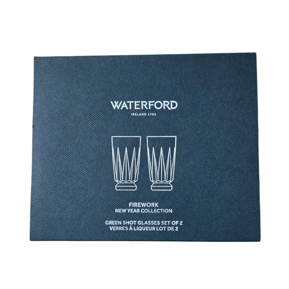 Blue box packaging for Waterford green shot glasses with white text on a white background