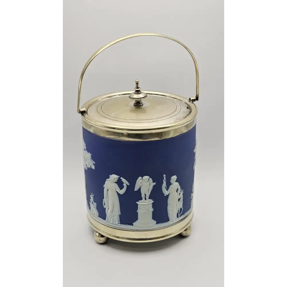 Decorative blue and white container with classical figures on a gray background