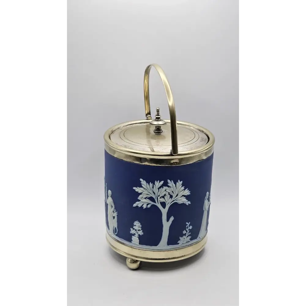 Decorative blue jar with white patterns and a gold lid