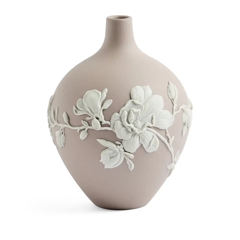 Ceramic vase with floral design on a white background