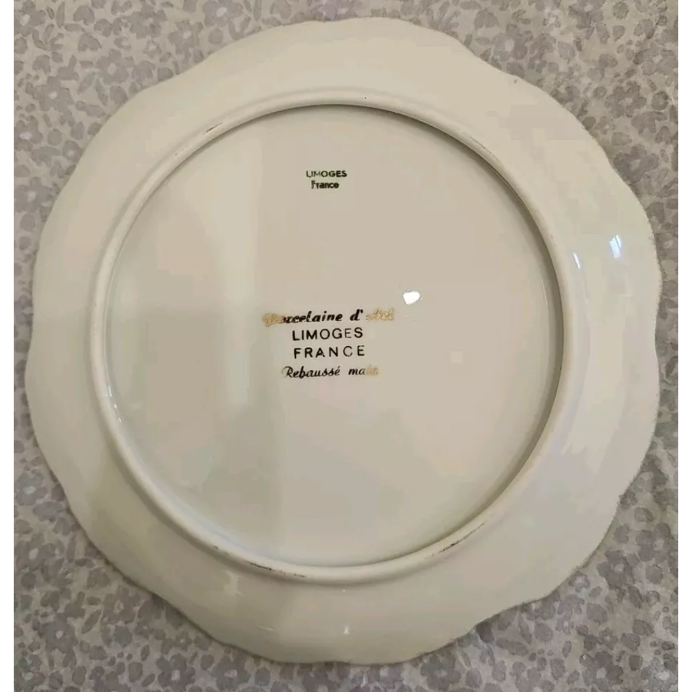 Back view of a ceramic plate with 'Limoges France' text