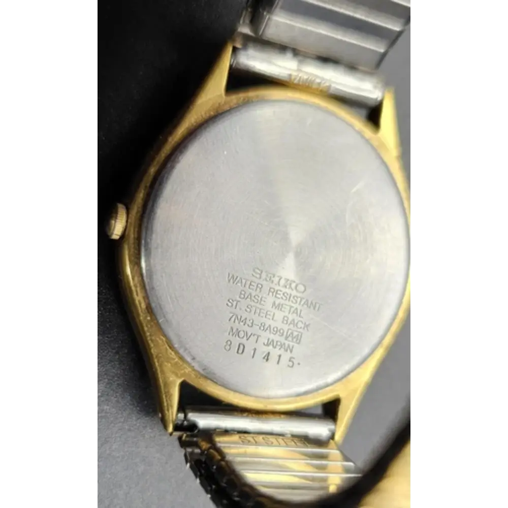 Back view of a Seiko watch with visible branding and model number.