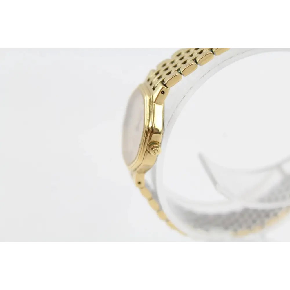 Gold watch with a white face