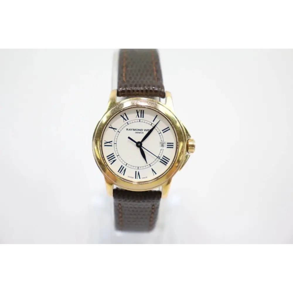 Wristwatch with gold case and brown leather strap