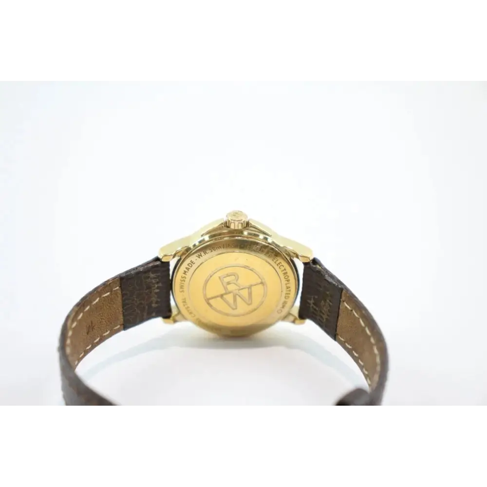 Gold watch with a brown leather strap