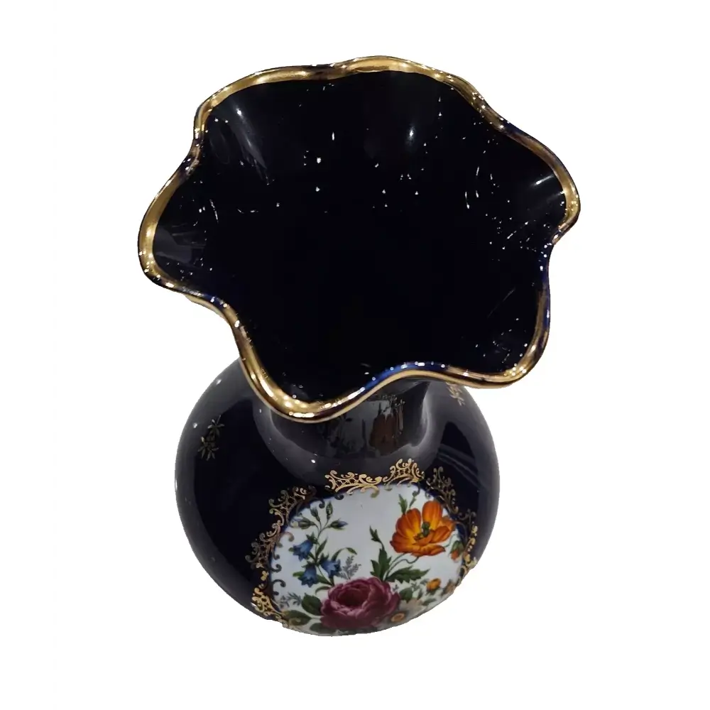 Black vase with floral design and gold accents