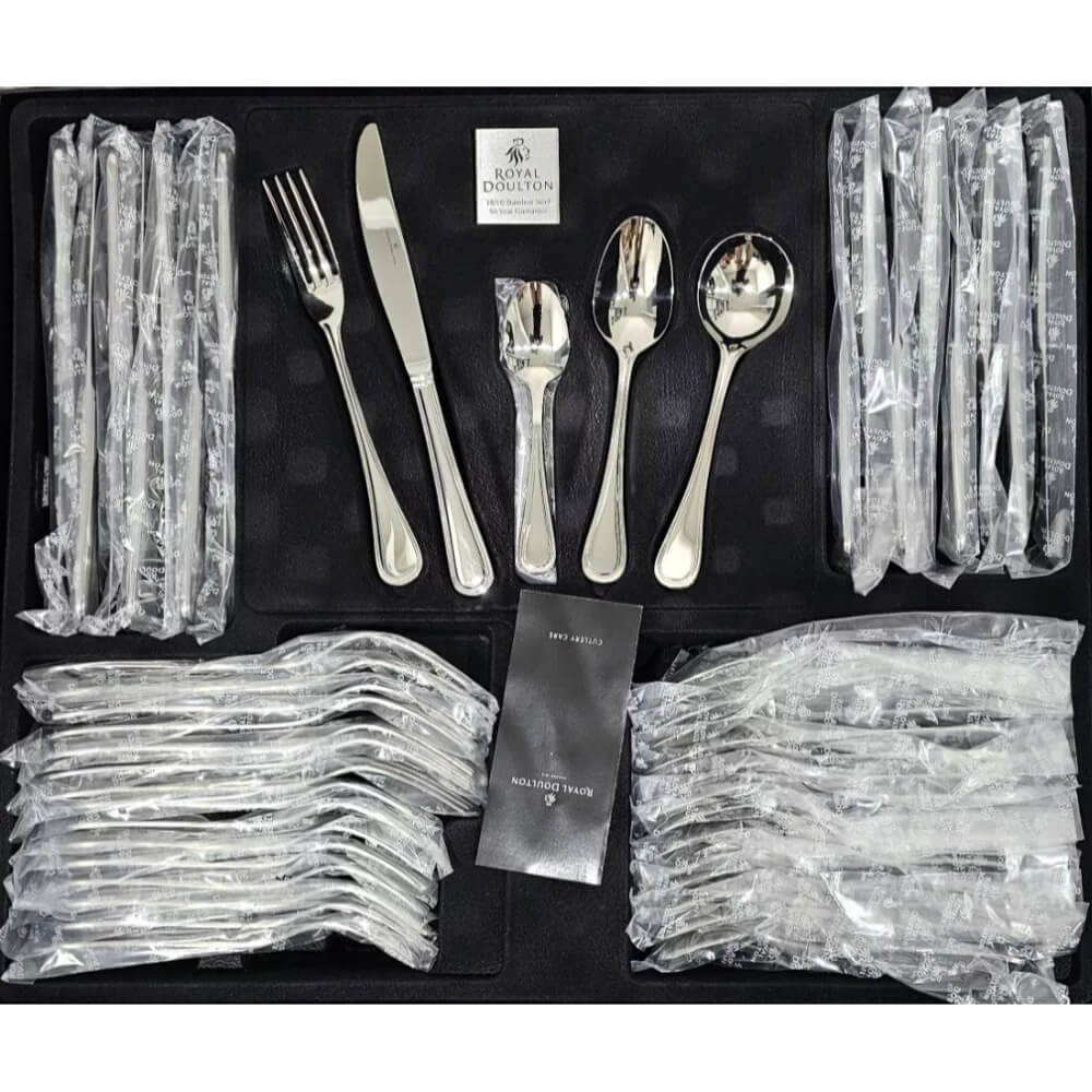 Set of silver cutlery with packaging