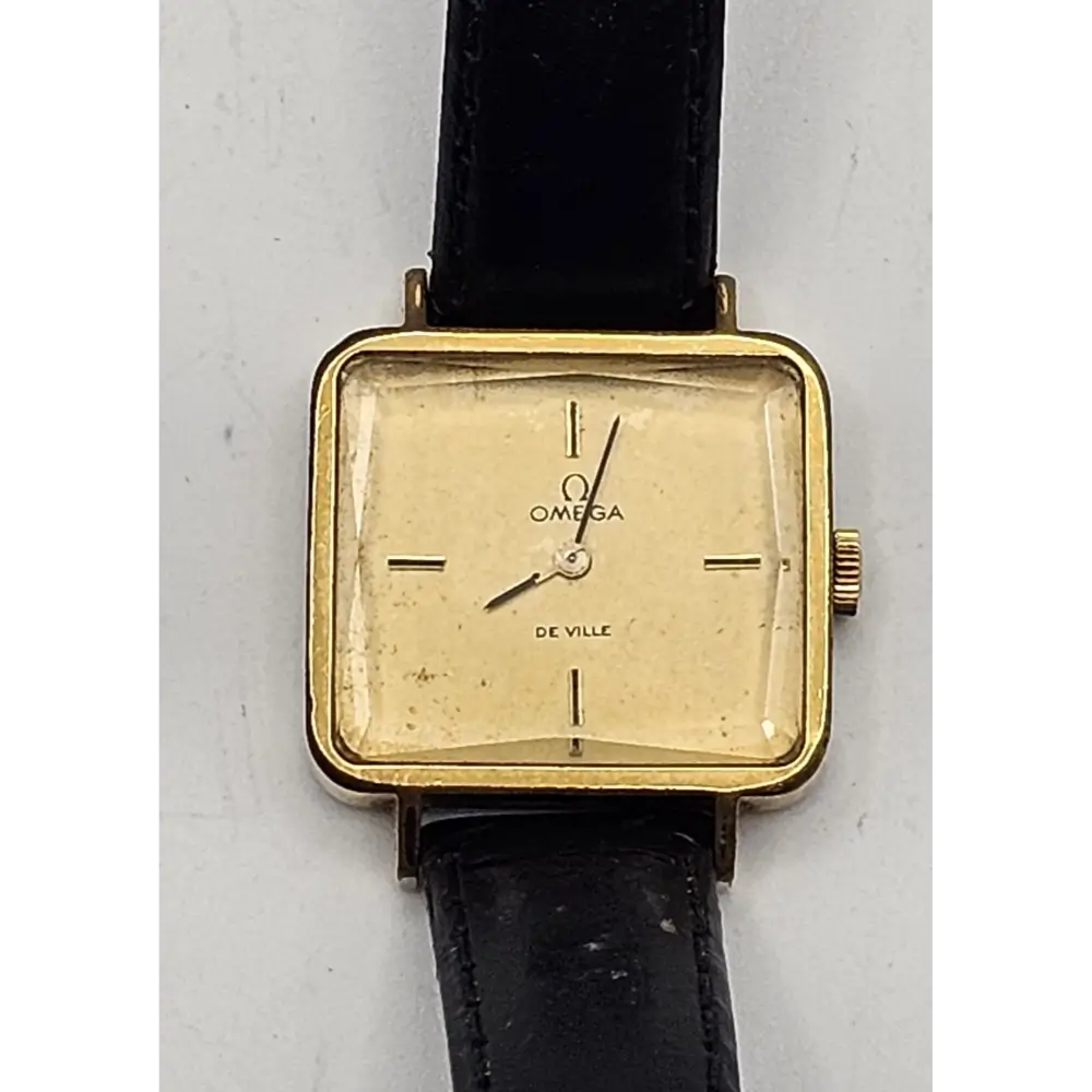 Vintage Omega watch with gold case and black strap