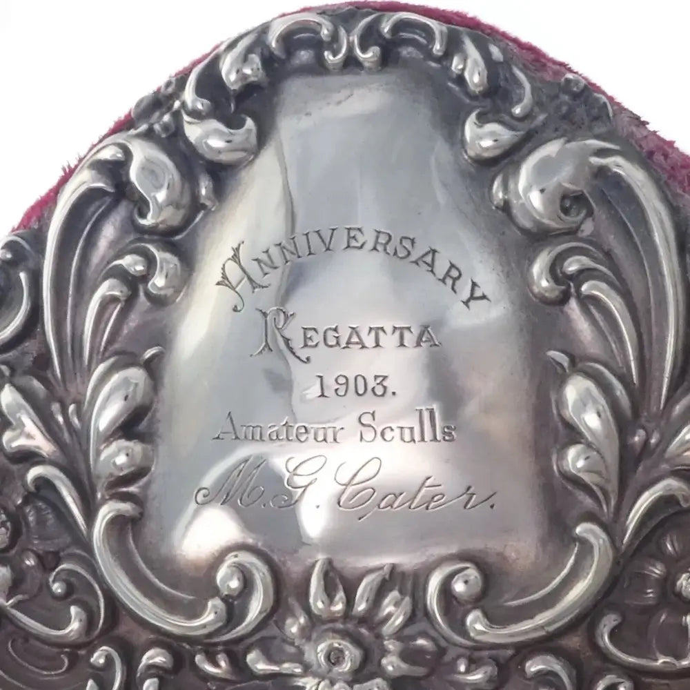 Decorative silver plaque with engraved text