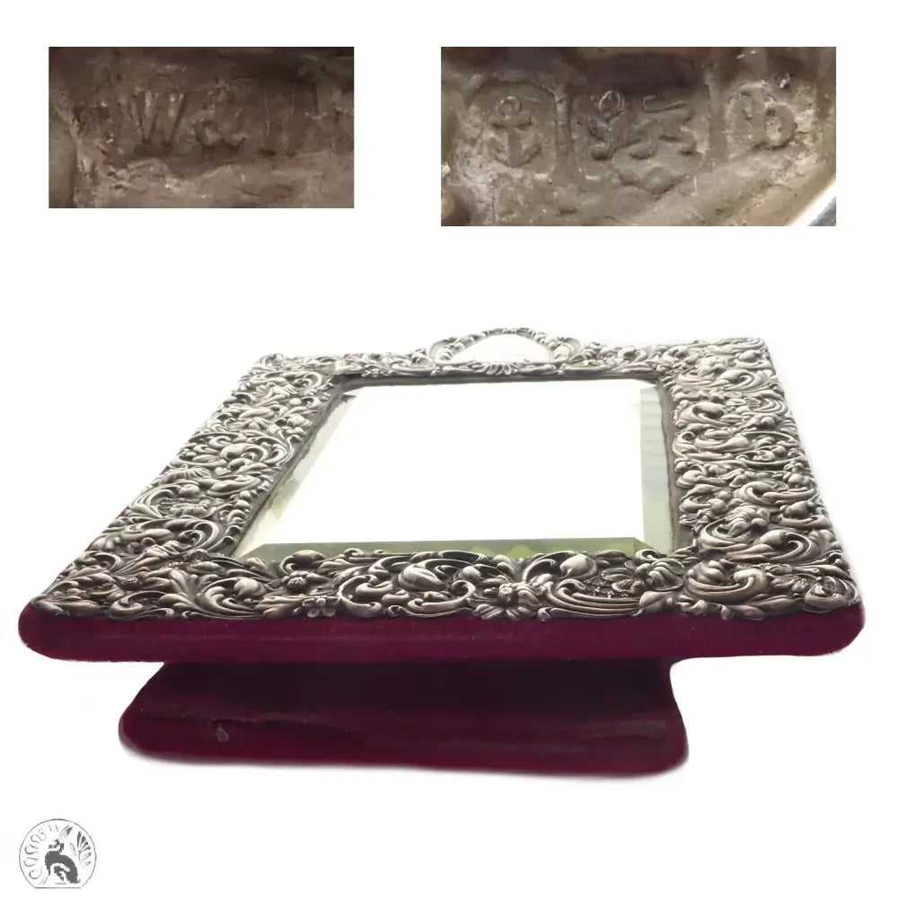 Decorative silver frame on a red stand