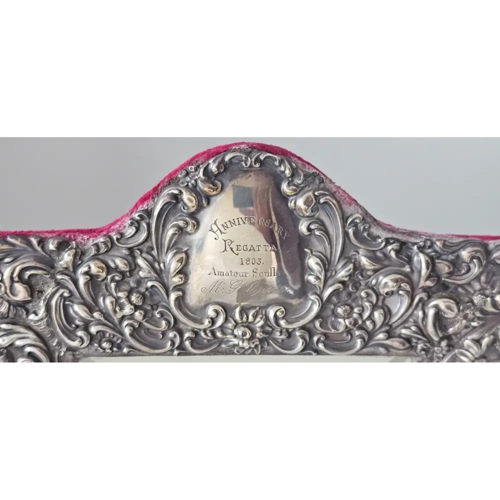 Decorative silver belt buckle with intricate designs