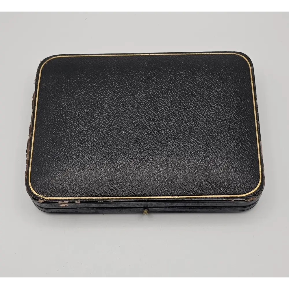 Black leather case on a gray background