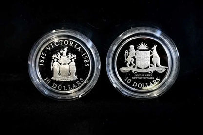 Close-up of 1985 Victoria and 1987 NSW Coat of Arms $10 proof coin designs | Koalaehub