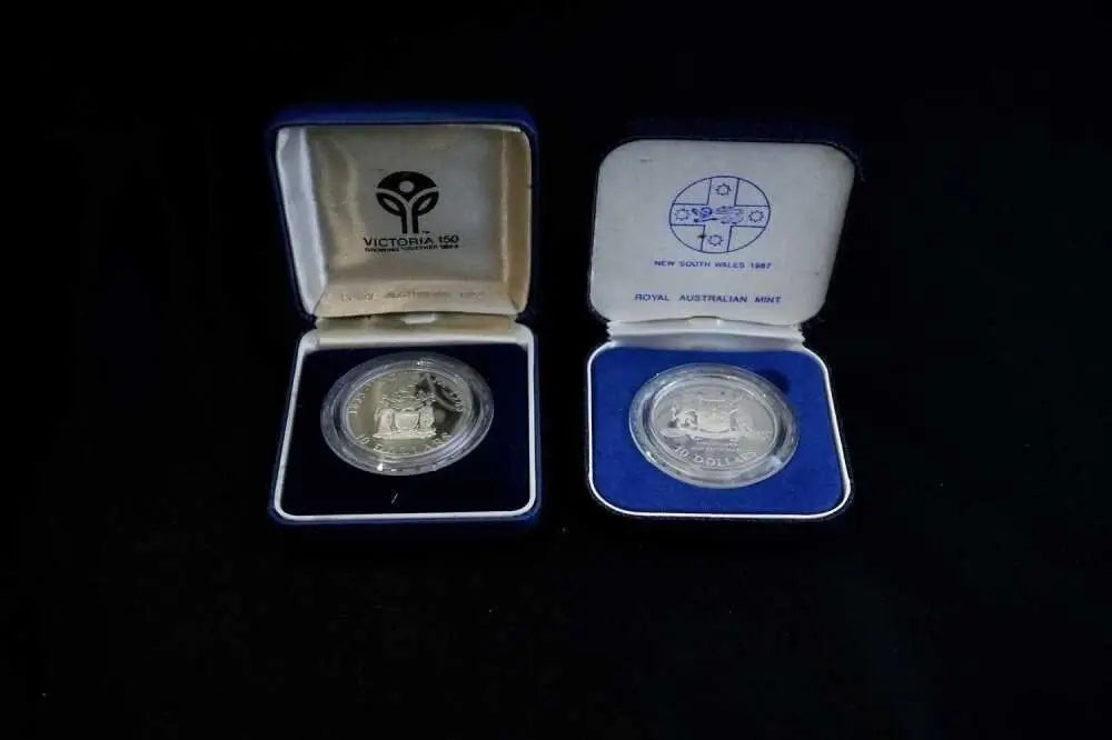Original Royal Australian Mint presentation boxes for 1985 and 1987 $10 State Series proof coins