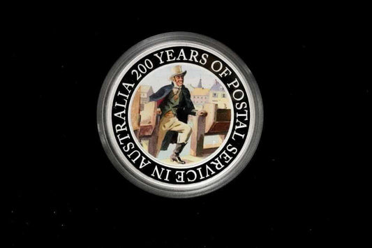 A circular commemorative coin or medallion on a black background, featuring a vintage illustration of a postal worker and the text 'AUSTRALIA 200 YEARS OF POSTAL SERVICE IN AUSTRALIA' around the edge frpom our Gold Proof Sets & Commemorative Medals collection 