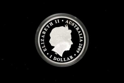 A circular silver coin featuring the profile of Queen Elizabeth II with the text 'ELIZABETH II • AUSTRALIA 2009 • 1 DOLLAR' around the edge, shown against a solid black background.