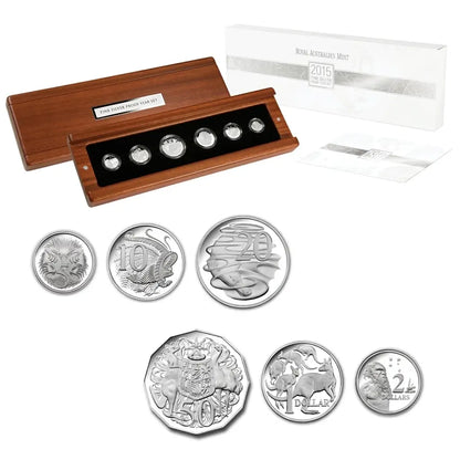 A 2015 Royal Australian Mint 70 cents coin set displayed with its wooden holder, white presentation box, and five individual coins on a clean white background.