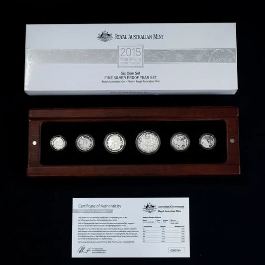 2015 Royal Australian Mint Fine Silver Proof Year Set in a wooden display case with a white presentation box and Certificate of Authenticity on a black background from our World & Vintage Coins collection 