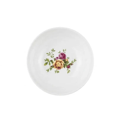 A white ceramic plate featuring a classic vintage floral design in the center with yellow, purple, and green roses and leaves, isolated on a white background.