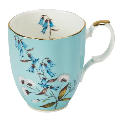 Teal mug with floral design
