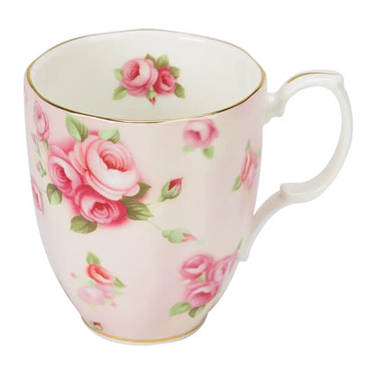 Pink floral mug with a white background