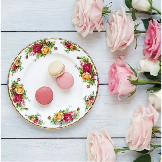 Decorative plate with floral design featuring macarons