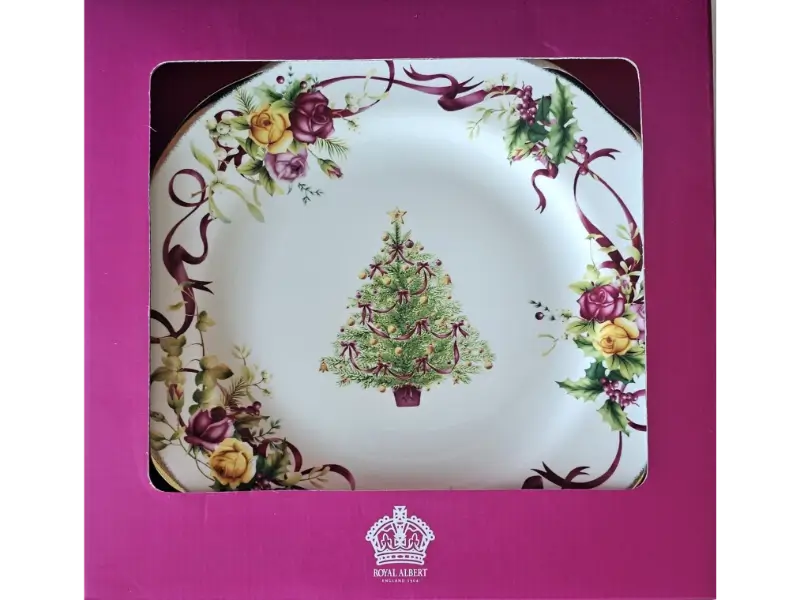 Decorative plate with Christmas tree design in a pink box, featuring Royal Albert branding.