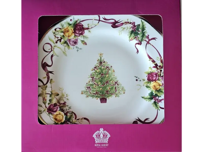 Decorative plate with Christmas tree design in a pink box, featuring Royal Albert branding.