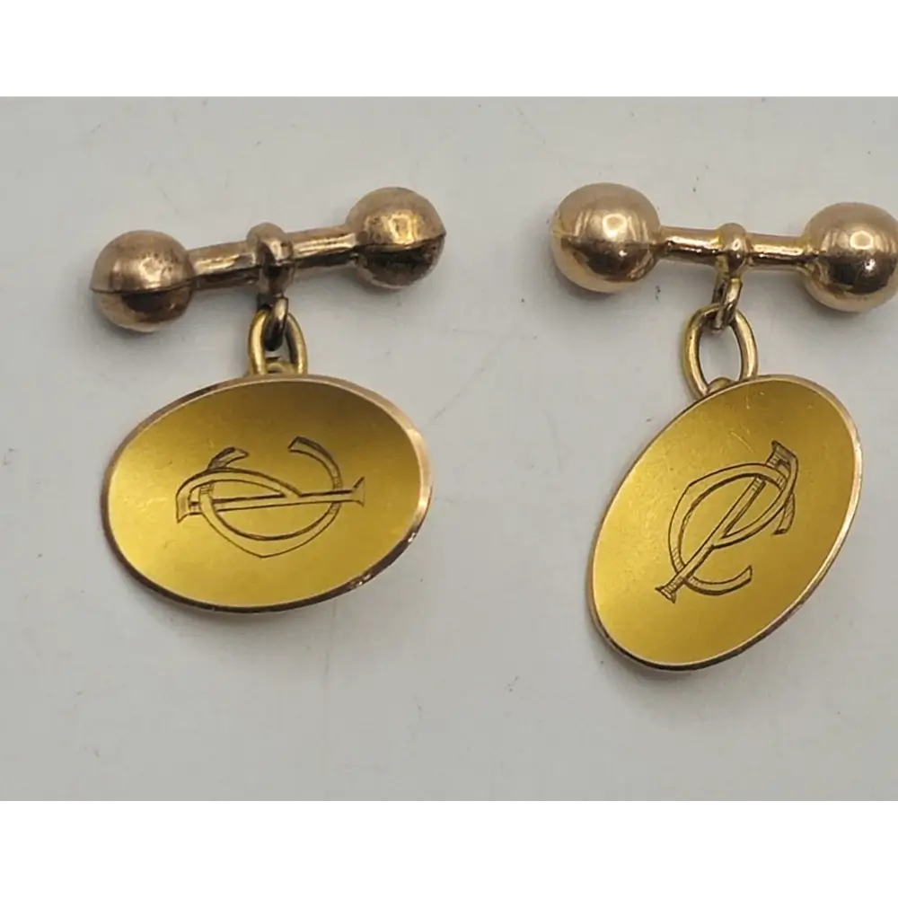 Close-up of Edwardian 9K Yellow Gold Cufflinks Showing Oval Monogram Design
