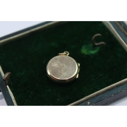 Gold pendant on a green velvet background