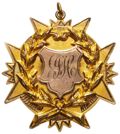 Antique 9ct gold star-shaped medal with laurel wreath and engraved J.J.H. monogram shield
