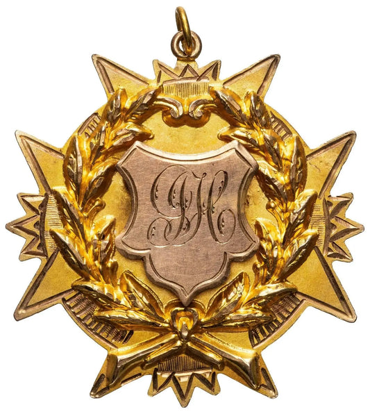 Antique 9ct gold star-shaped medal with laurel wreath and engraved J.J.H. monogram shield