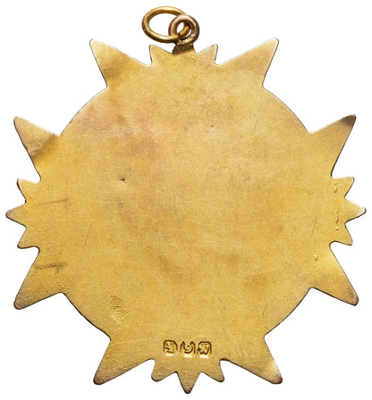 Reverse of antique 9ct gold medal showing plain gold back and small marks