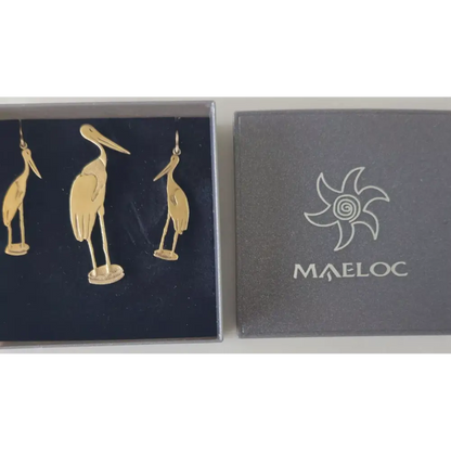 Gold bird-shaped earrings in a Maeloc branded box on a white background