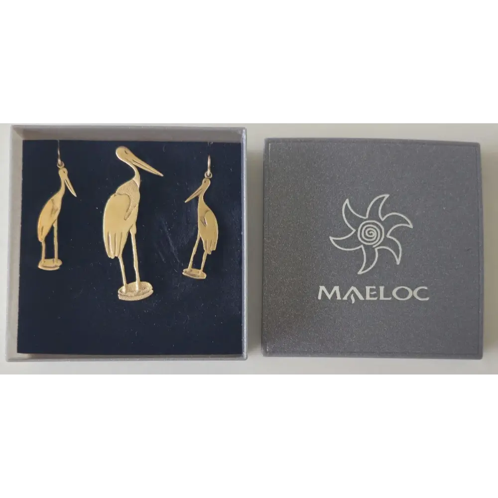 Jewelry box with gold bird-shaped earrings and Maeloc logo